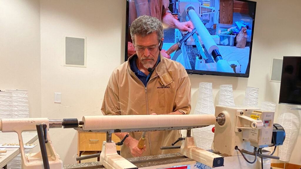 Claude Godcharles demonstrates spindle turning. The picture is included into woodturners newsletter.