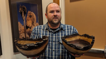 Nate Segraves is holding two Walnut bowls