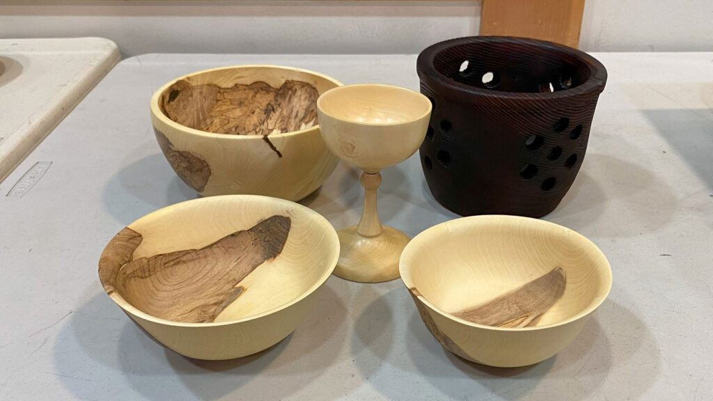 Turned bowls and a flower pot by Tom Gaston