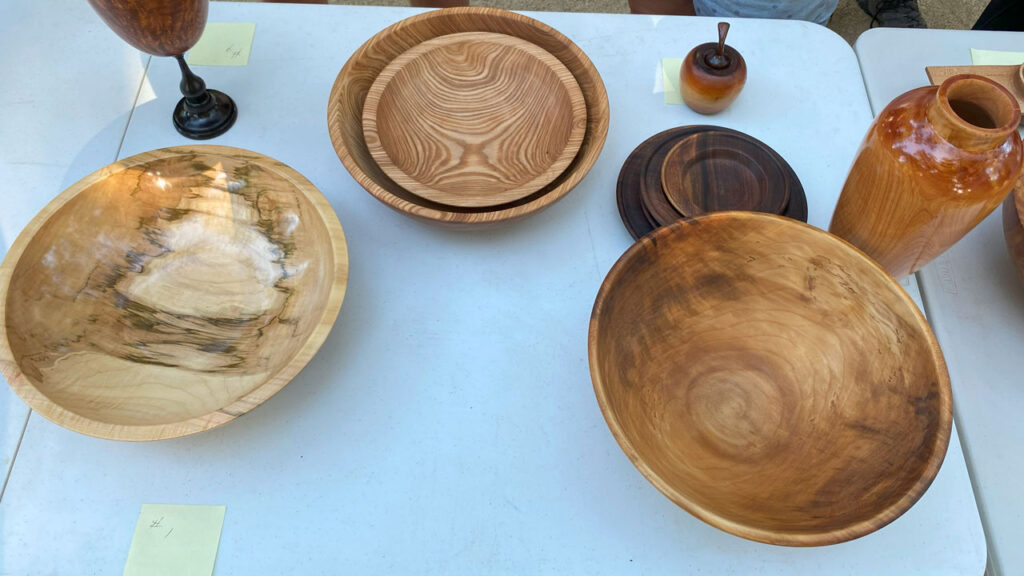 Various woodturned bowls, platters, and vases.