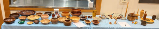 All woodturning projects are placed on the table during the meeting of the West Bay Woodturners club in September 2024. To be used in the Woodturners Newsletter.