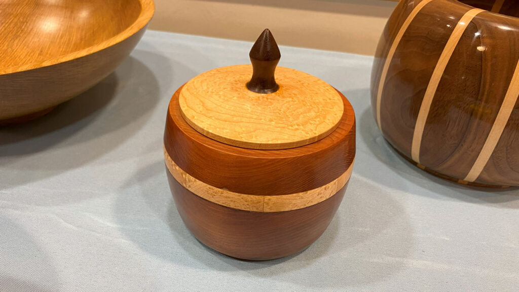 Turned lidded box made from maple and cherry.