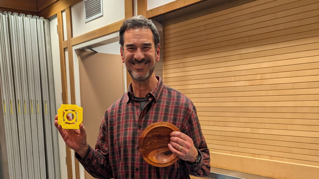 Chip Krauskopf shows his sharpening jig and a turned platter.