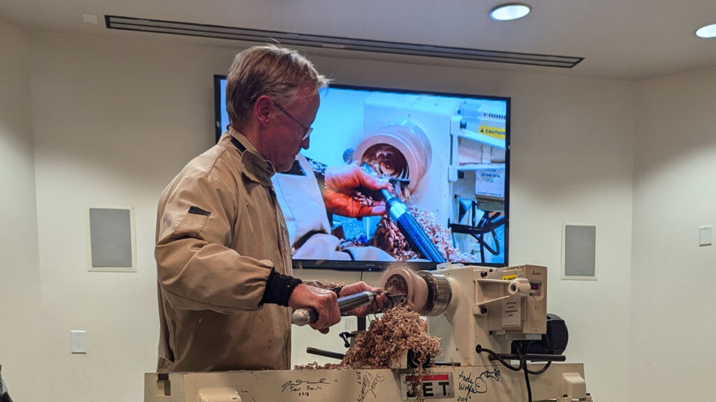 Tom Gaston behind the lathe. Tom demonstrates hollowing.