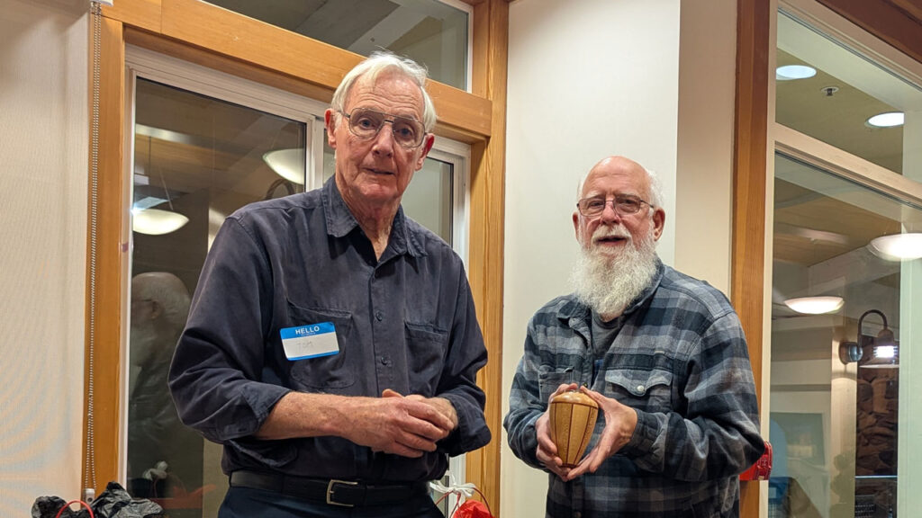 Tom Kenyon made a segmented vase using birds eye maple, bloodwood, and sycamore. He gave it to Harvey Klein.