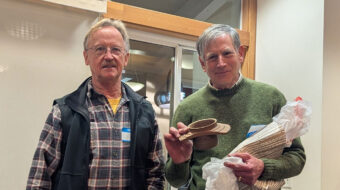 Tom Gaston presented Tom Mandle with a handled bowl made of walnut.