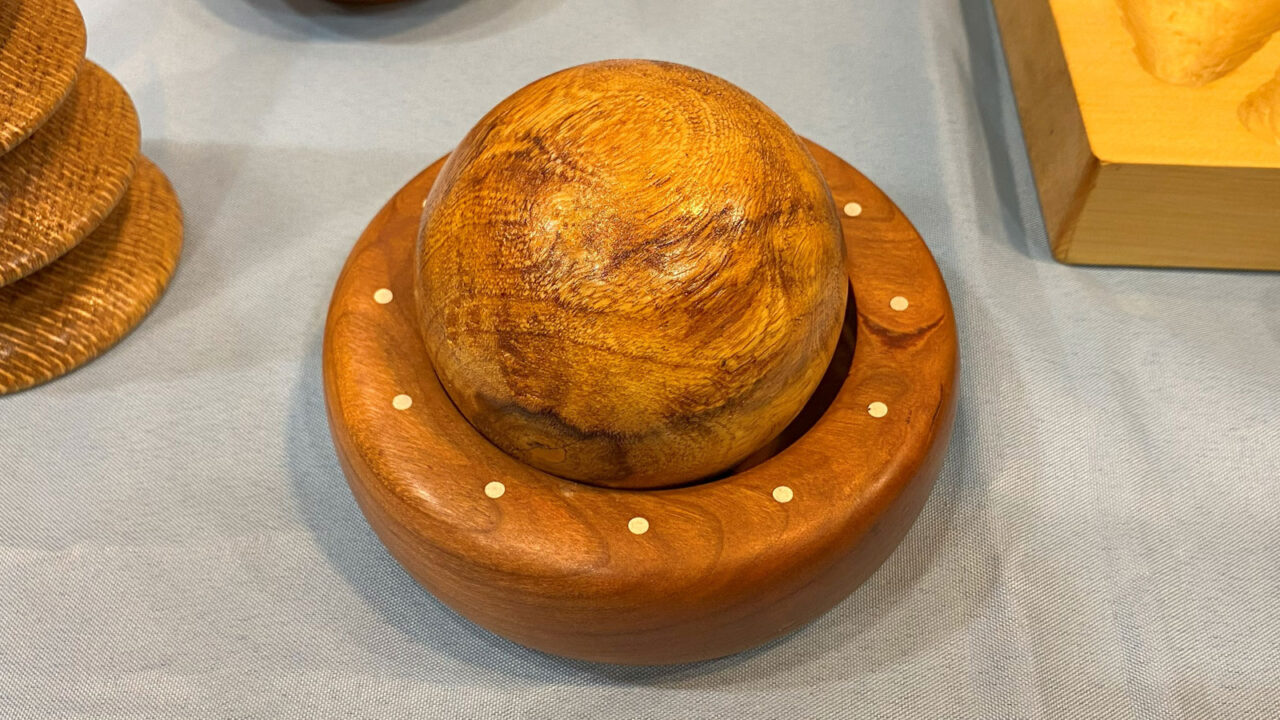 Bowl and sphere with dot inlays