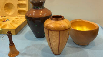 Woodturning vases, a bowl, and a bell