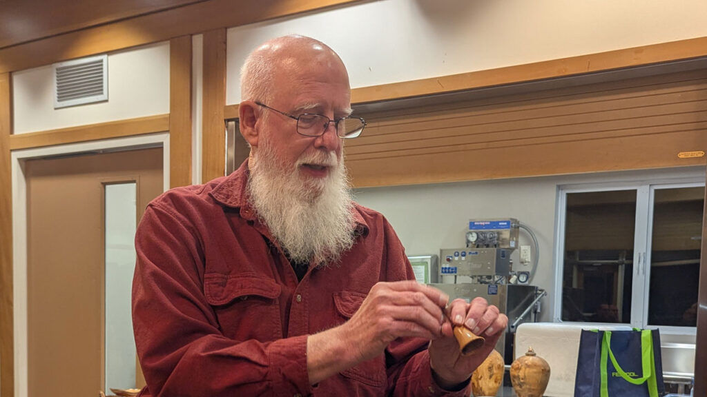 Harvey Klein turned a bell for gift exchange.