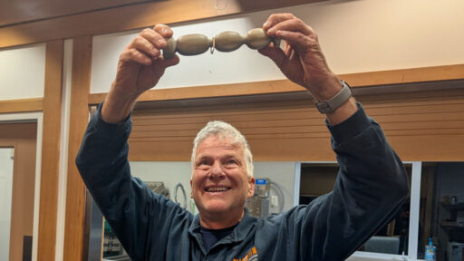 Joe Martinka turned a captive ring on a woodturning sample.