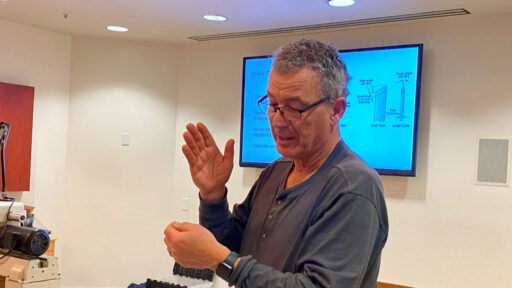 Jon Bishop's explains turning with a skew to the club members. The picture is taken for the woodturners newsletter.