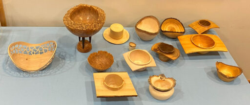 Table with woodturned bowls: natural edge and bowls with handles.