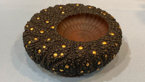 An offset bowl decorated with a rose engine and embellished with rotary bits by Brad Bond.