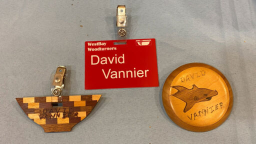 Name badges: two handmade by David Vannier. One is printed.