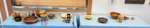 Tables with woodturning projects for the West Bay Woodturners Newsletter, June 2025.