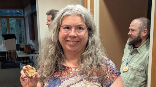 Angela Gunn turned her nametag from a lovely piece of spalted birch.