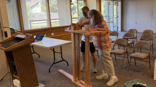 Laura and Jerry are assembling a reciprocal lathe.