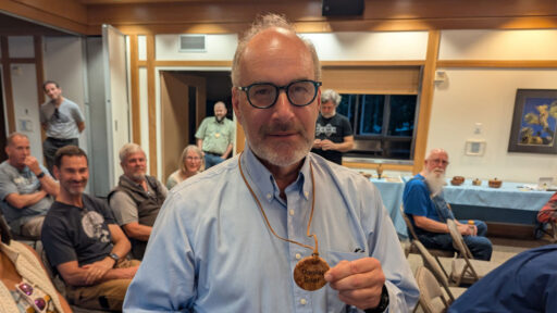 Daniel turned his name badge from a burl