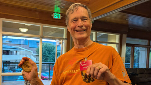 David shows three of his name badges