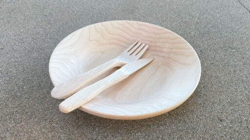 A woodturned platter with a carved fork and knife from maple. Visit https://readntry.com for more of Roman's projects.