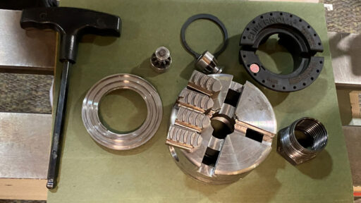 A disassembled woodturning chuck to demonstrate maintenance steps.