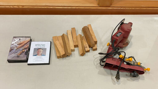 DVDs, pen blanks, and a cutting device.