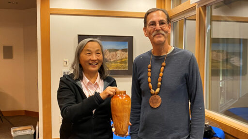 Alison received a tall vase from Kelly