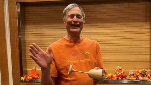 David is showing a goblet he turned on a lathe.