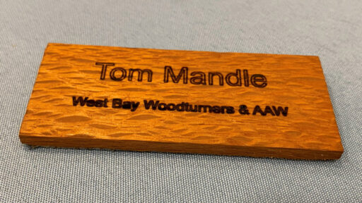 Name tag made from lace wood.