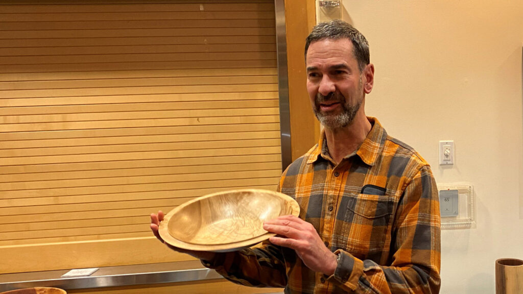 Chip shows a large camphor bowl that he turned on a lathe