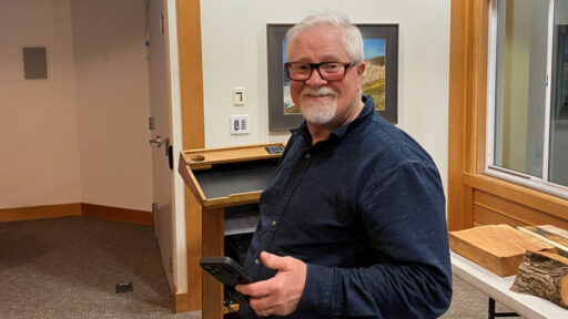 Jim is holding his phone