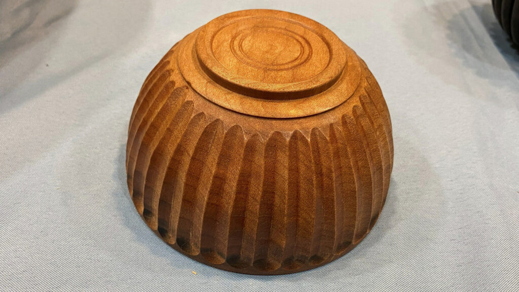 Exterior surface of a small bowl with the flutes made by Jon Bishop using a router.