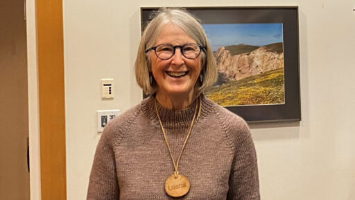 Luana Staiger wears her woodturned name badge.