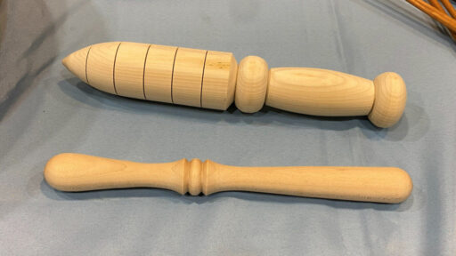 Examples of Nick Cook's work: a garden dibbler and a muddler.