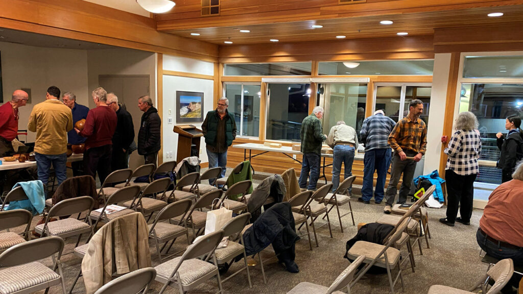 Members of the West Bay Woodturners club during a break.