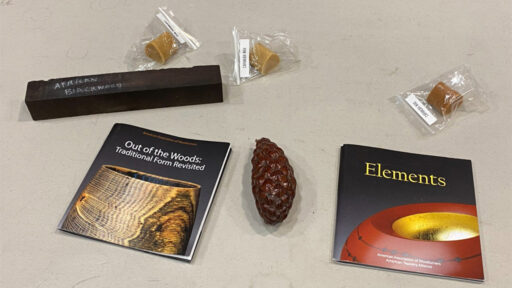 Woodturning supplies: polishing wax, pen blank, and other items.