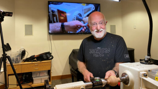 Vic is demonstrating how to turn a sphere on the lathe.
