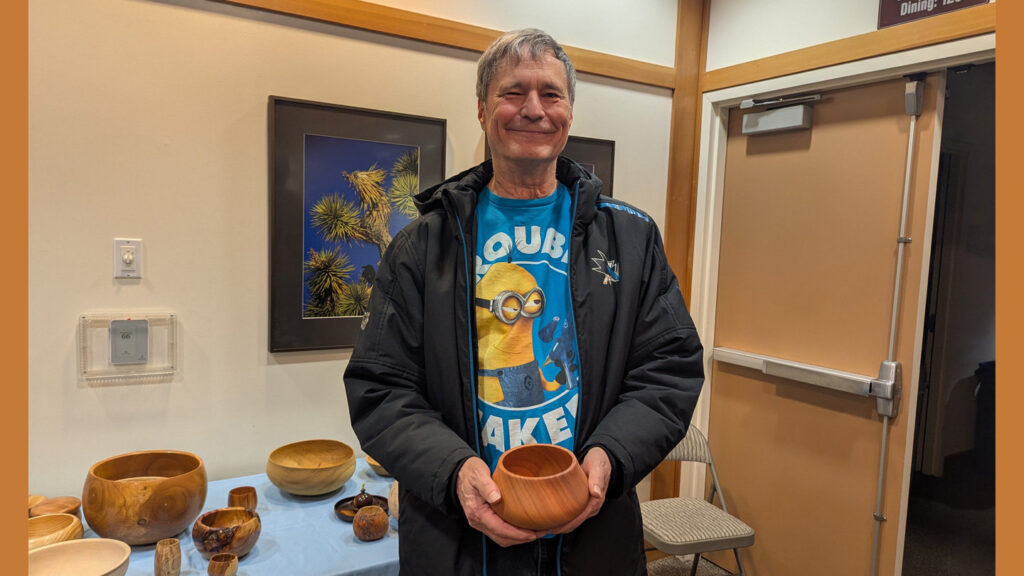 Dave is showing a calabash bowl that he recently turned.
