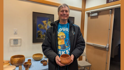 Dave is showing a calabash bowl that he recently turned.