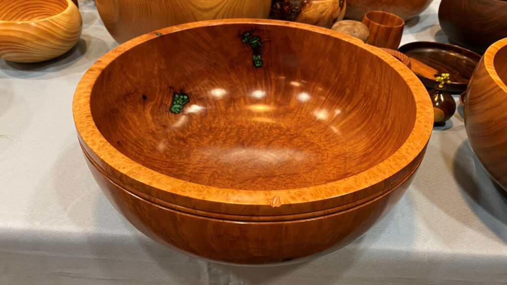 A large calabash bowl with stone inlay turned by Dennis Lillis.