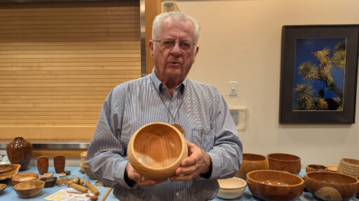 Ed Howes is showing a calabash bowl he recently turned.