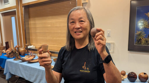 Alison is showing three turned spheres and a stand for a sphere.