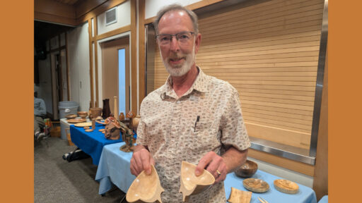 Dean is holding two halves of a turned bowl.