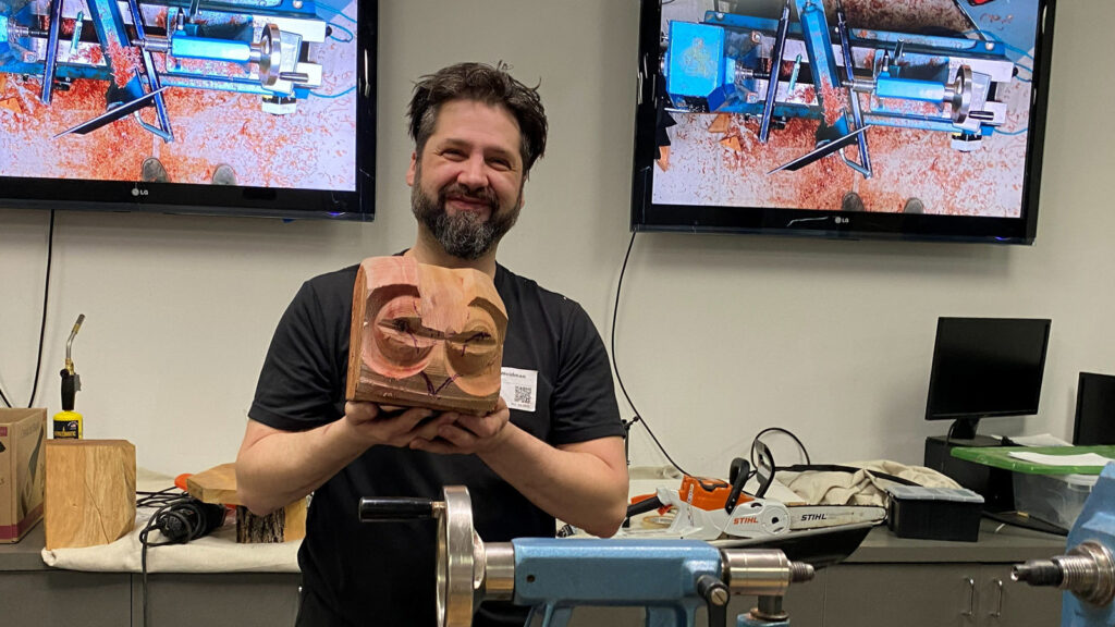 Derek Weidman is showing a work in progress: an owl made by using multi-axis turning techniques.