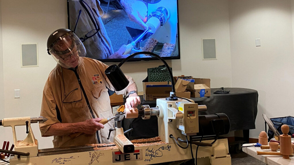 Edgar is turning an egg cup on a lathe.