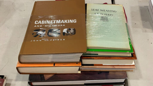 A stack of woodworking books.