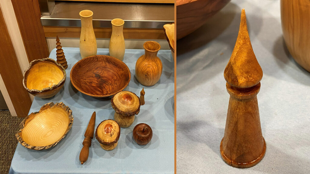 This is a split image displaying a collection of woodturning projects. The left side shows a variety of turned wood items arranged on a light blue table, including two tall, pale vases, a darker, bulbous vase, a large bowl with reddish grain, two live-edge bowls, and several small turned objects such as a spiral tree, mushroom shapes, and a small sphere. The right side features a close-up of a tall, stylized, polished wooden castle with a conical base and a sharp, pointed top, resembling a chess piece or finial.