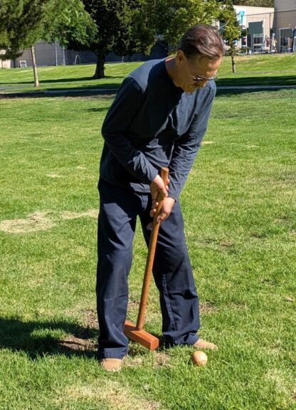 Kelly Smith playing croquet at the August 2026 WBW/SVW annual picnic.