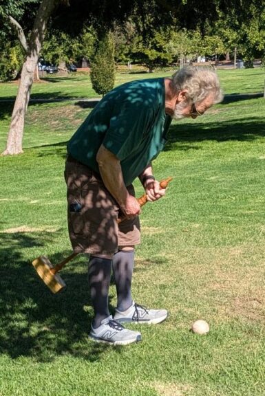 Steve Dahout playing croquet at the August 2026 WBW/SVW annual picnic.