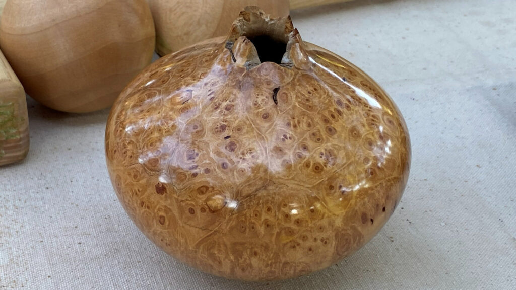 A polished burl wood hollow form by Dylan McVoy.